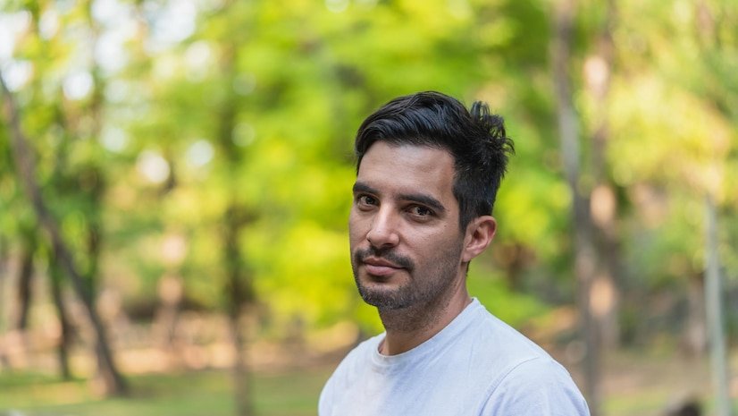 portrait-young-man-standing-outdoors_1048944-13254398